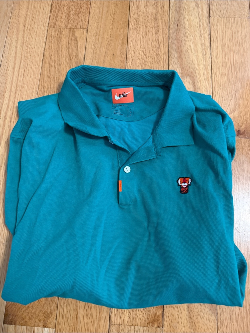 Nike Men’s Teal Polo with Embroidered Patch